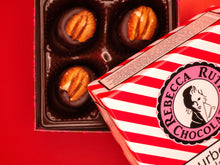 Box of Rebecca Rutlh chocolates on a red background