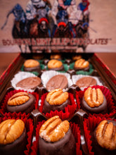Box of bourbon and mint julep chocolates with a blurred background