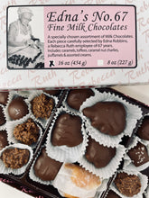A box of assorted milk chocolates including caramels, toffees, and various other chocolate candies. 