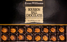 Box of Bourbon Ball Chocolates with Evan Williams branding on a dark background