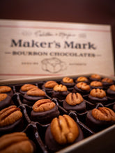 Box of Maker's Mark bourbon chocolates with pecans on top.