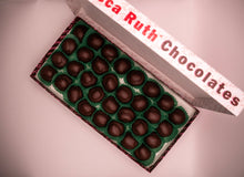 Box of Mint KY Colonels with 'Ruth's Chocolates' branding on a pink background