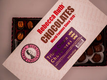 Rebecca Ruth Chocolates packaging with a display of chocolates.